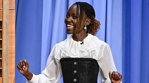 Nyong'o in white shirt and black corset.
