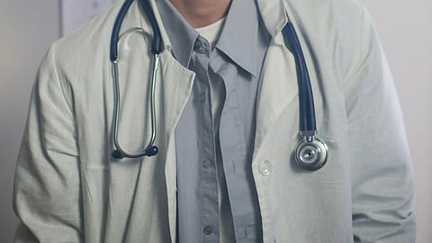 Doctor in white coat and stethoscope. 