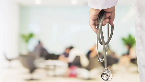 doctor hand holding stethoscope