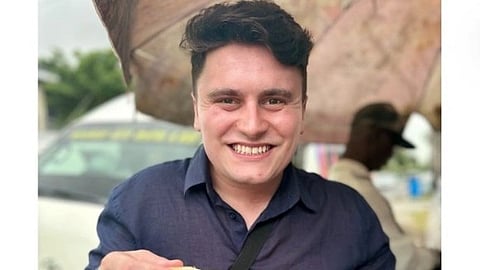 Alex Warwick in a navy blue shirt.