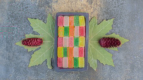 Sugary marmalade in a dark board on a dark background
