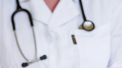 A doctor with stethoscope around neck.