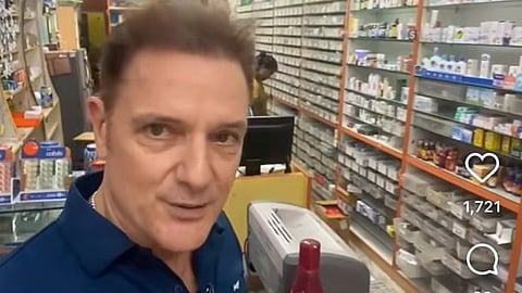 Screenshot from the viral video where an Australian traveller Carl Andre Wharte in a pharmacy store.