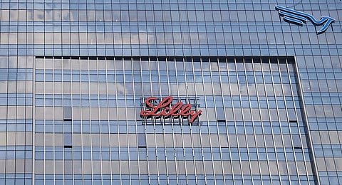 Office building of Eli Lilly, a glass building with Lilly written in running letters.  