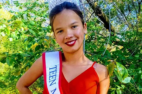 Makayla Skjerva  wearing a red dress