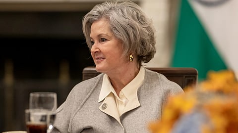An image of Susie wiles sits at a conference table.