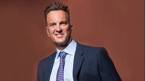 Dr. Ronald Demeo in a navy coat and tie.