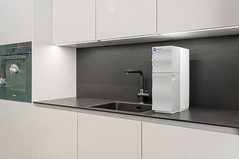A water purifier near kitchen sink.