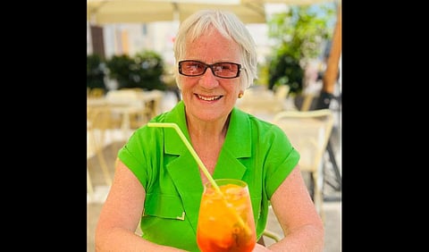 Miriam Lancaster with a glass of cool drink