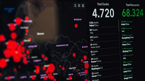 A digital map displays red circles over countries indicating COVID-19 spread. Text shows 4,720 deaths and 68,324 recoveries.