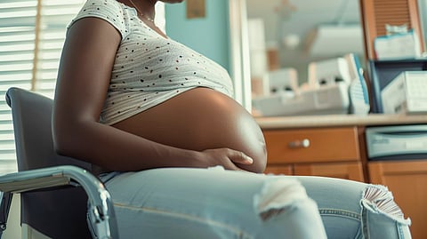 Black pregnant women posing