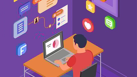 A person in a red shirt using a laptop at a desk, with floating digital icons showing messages, charts, and likes.