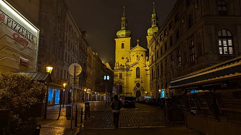 A street in Germany with a big building at the end.