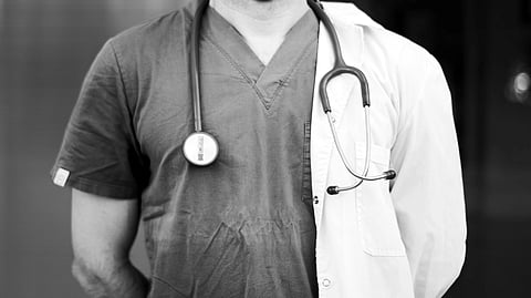 Doctor with stethoscope around neck.