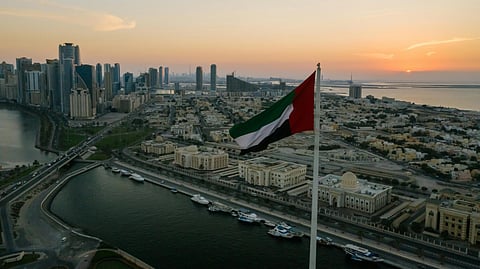 A uae flag and skyline.