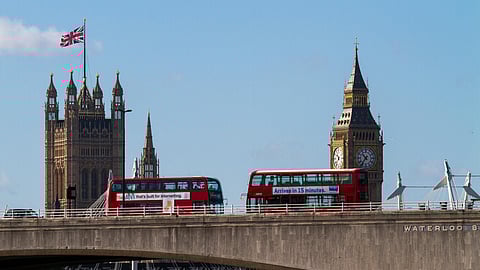 Big Ben and red buses.