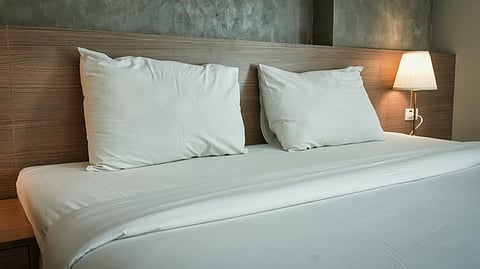 White bed sheet and pillows.