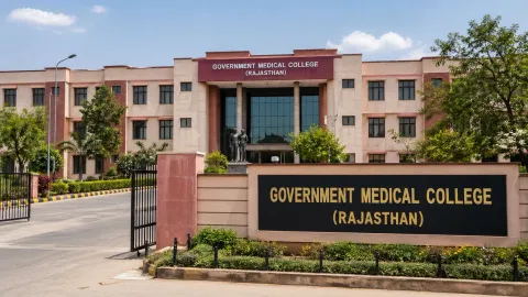 A college building in marron with Government Medical College Rajasthan.