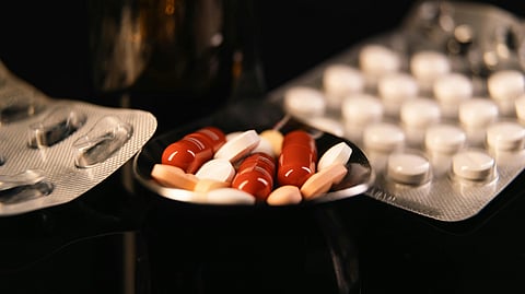 Pills on tray and pill strips.
