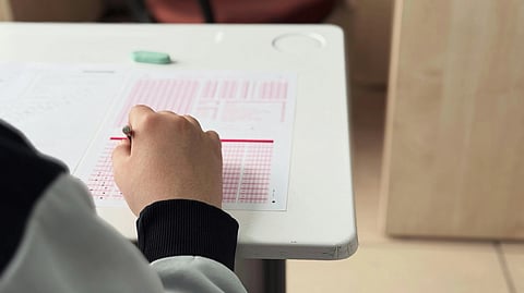 A student taking exam on omr sheet