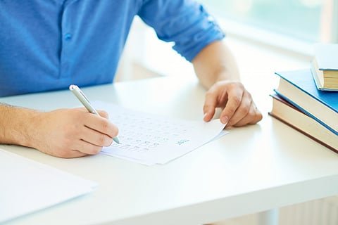 Close-up hands in exam