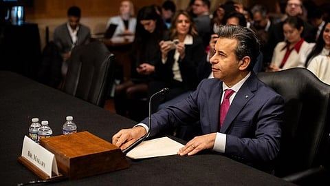 A man labeled “Dr. Makary” sits at a table with a microphone in a formal meeting.
