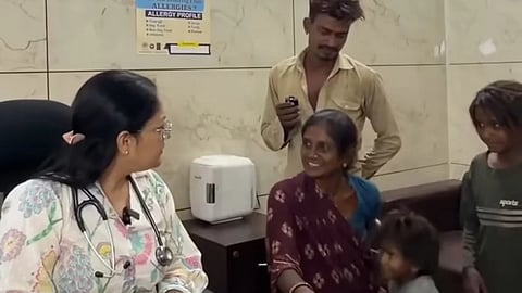 A doctor speaks with a young woman and her family inside a clinic during a consultation linked to discussions on repeated pregnancies and maternal health.