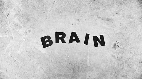 Black and white photo featuring the word "brain" prominently displayed in a bold font.