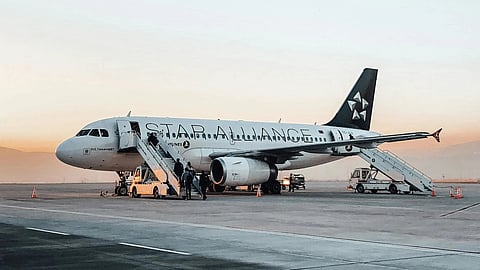Passenger aircraft on an airport tarmac, representing the flight involved in a heat-related incident at a Miami-area airport.