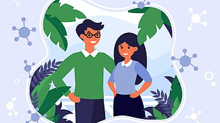 A couple stands together in front of a vibrant tropical background.