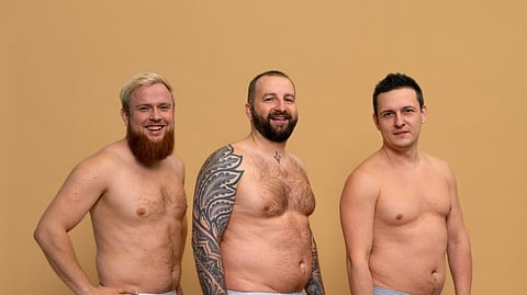 Full shot men posing together in studio