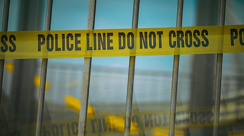 Representative image of a police crime scene with barricade tape.