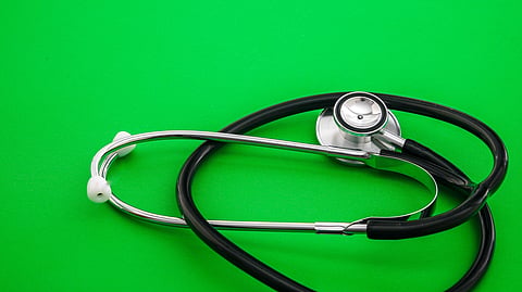 A stethoscope on green background.