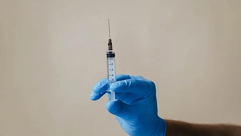A vaccine in hand.