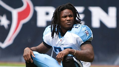 Chris Johnson, running back with the Tennessee Titans sitting on his helmet before a game against the Houston Texans on November 28, 2010.