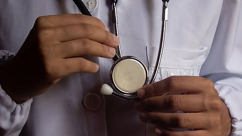A doctor holding a stethoscope.