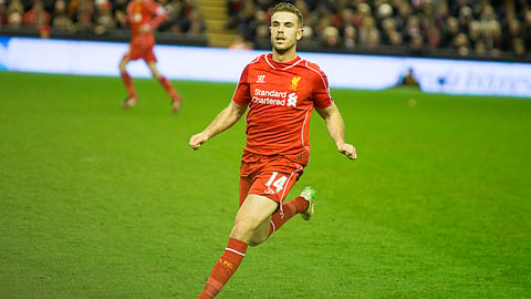 Jordan Henderson playing for Liverpool F.C. in a Premier League match against Arsenal at Anfield on 21 December 2014.