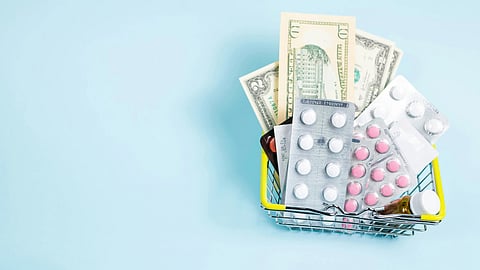 Basket containing medicines and cash representing rising prescription drug costs
