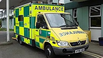 Ambulance parked outside an emergency medical facility.