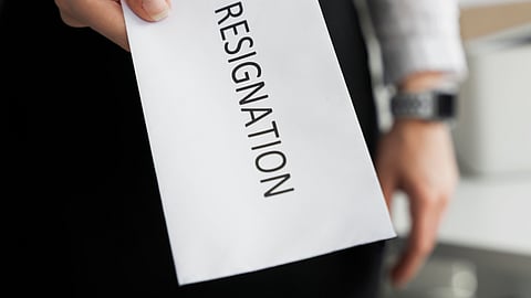 A resignation letter in hand.