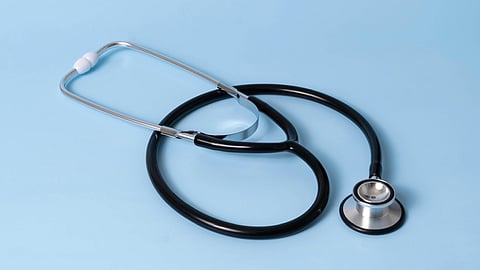 Stethoscope on blue background.