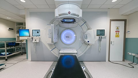 An MRI machine inside a hospital treatment room.