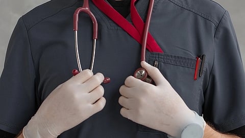 A doctor holding a stethoscope.