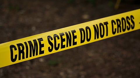 Crime scene tape representing a police investigation.