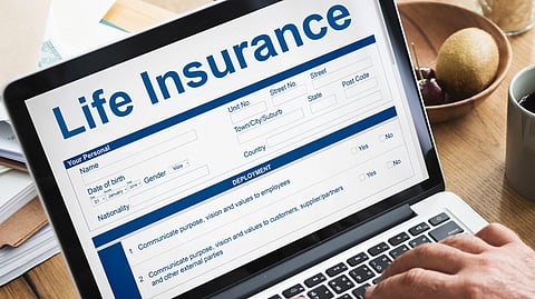 Life Insurance form on a laptop screen.