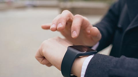 A man using his smart watch