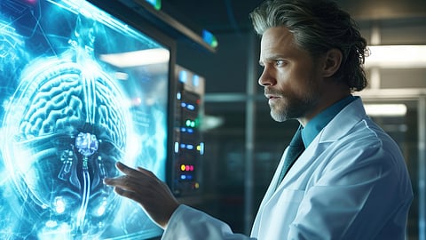 A scientist studies a digital brain scan.