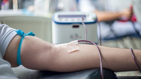 A person giving blood.
