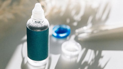 An eye drop with blue label.