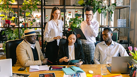 A team of professionals working together in an office.
